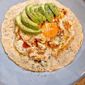 Delicious Feta Fried Egg on a Low Carb Tortilla with Pesto and Avocado Slices